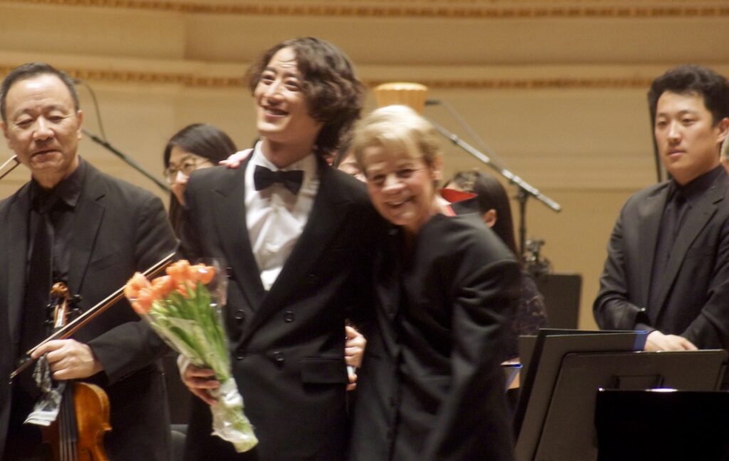 Hayato Sumino and Marin Alsop with the Philadelphia Orchestra onstage at Carnegie Hall