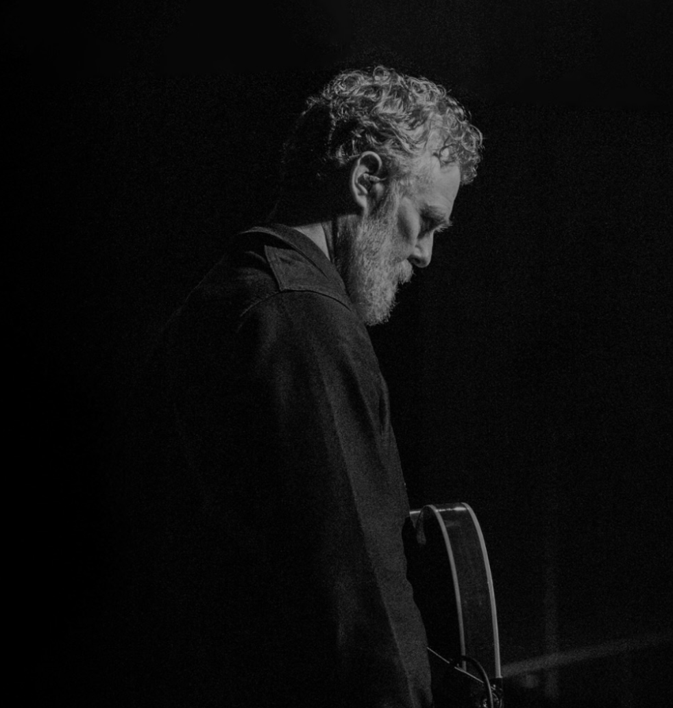 Glen Hansard portraint in black and white with guitar