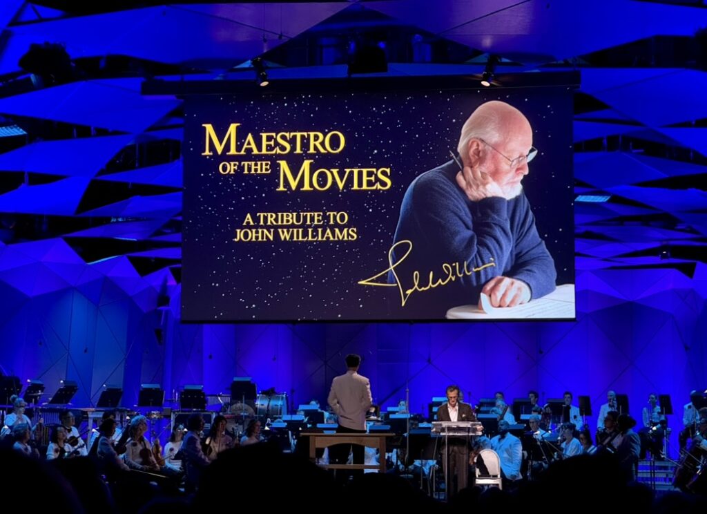 Turner Classic Movies host Ben Mankiewicz and conductor Ken-David Masur onstage with the Boston Pops at John Williams Film Night at Tanglewood, 8/15/26